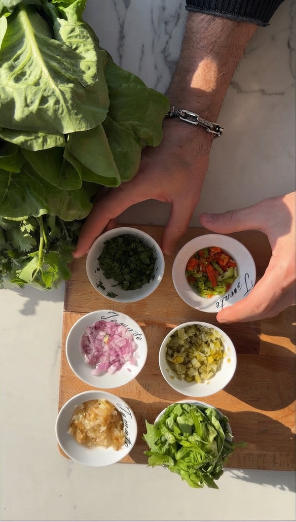 Toss diced tomatoes, chopped red onion, fresh cilantro, salt, and squeezed lime juice in a bowl until combined.