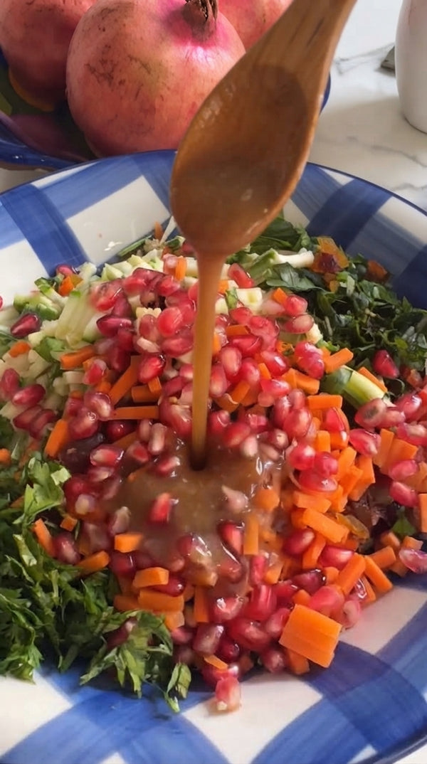 Finely dice cucumbers, carrots, bell pepper, and Uzbek apricots; chop fresh herbs finely.