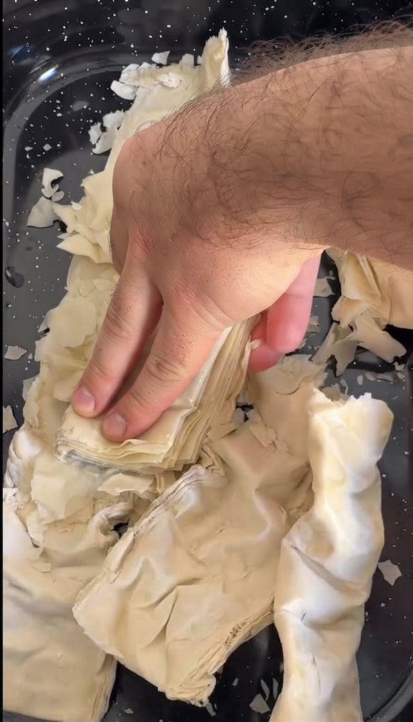Leave phyllo sheets open to dry at room temperature or bake at 100°C for 10 minutes until brittle. Crumble into small ragged pieces.