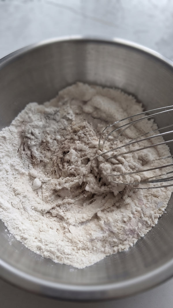 Fold in almond flour, baking powder, and sea salt to form a uniform soft dough.
