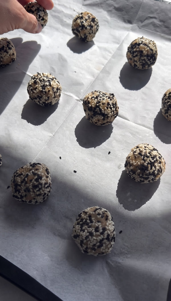 Arrange on a parchment-lined baking sheet, flatten slightly, and bake at 170°C (340°F) for 12–15 minutes until light golden