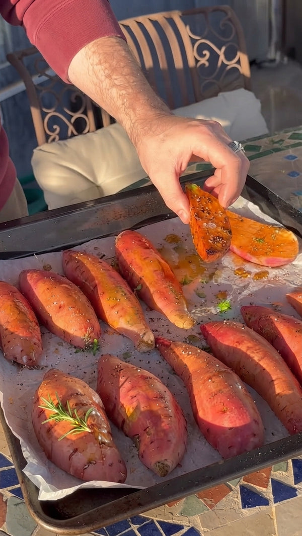 Wash and slice the sweet potatoes in half lengthwise. Score the skin/flesh lightly with a knife.