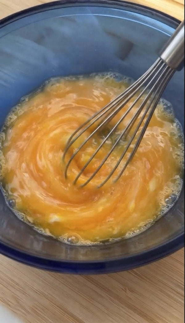 In a bowl, mix crumbled feta, grated yellow cheese, ricotta, and 1 egg until well blended.