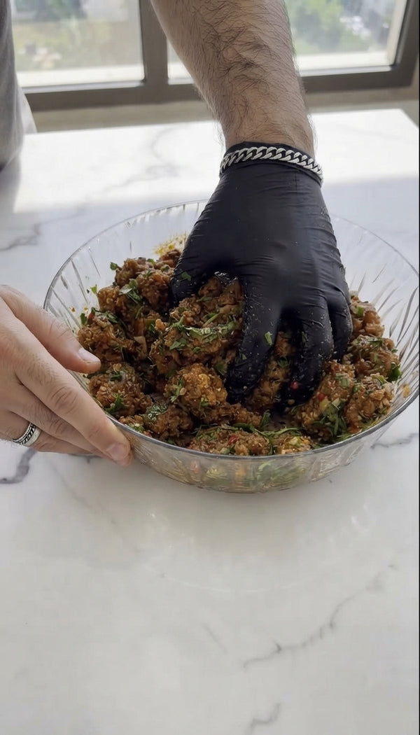 Carefully place fish meatballs into the bubbling sauce. Cover, reduce heat to low, and cook (
