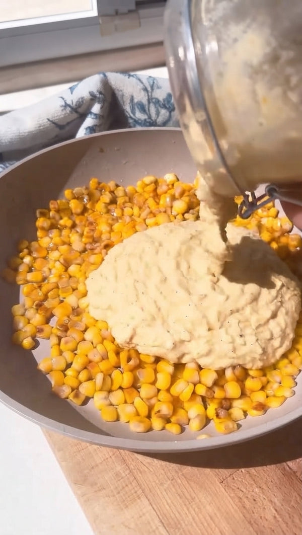 Pour in the blended corn mixture, remaining coconut milk, soy sauce, maple syrup, curry powder, salt, and pepper. Bring to a gentle simmer for 3-4 minutes until rich and velvety.