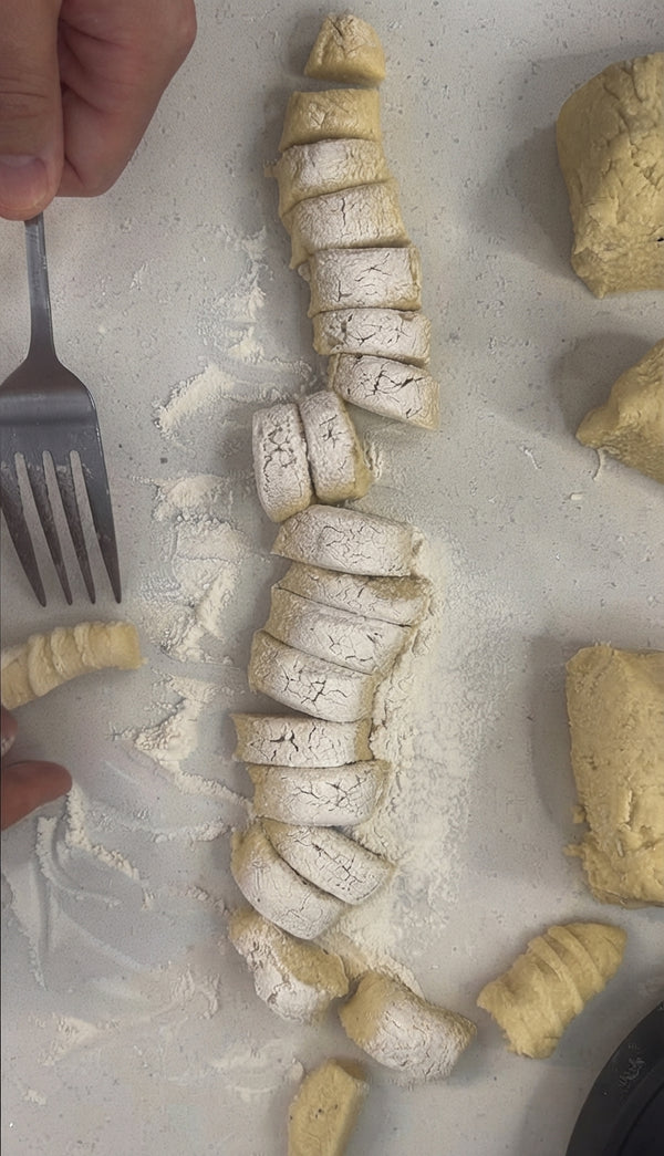 Lightly sear minced garlic in butter and olive oil. Stir in cream,
nutmeg, salt, and pepper. Simmer gently, then whisk in Parmesan and Pecorino until
creamy. Toss hot gnocchi directly into sauce and serve immediately.