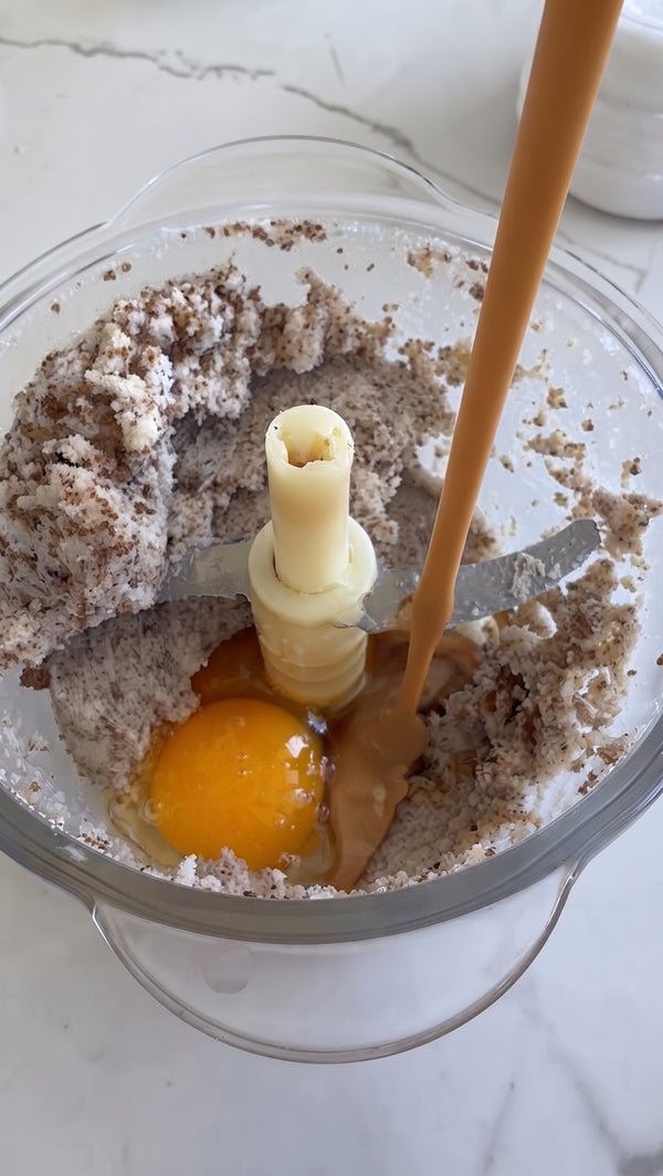 Add the egg and vanilla extract. Pulse just until the dough comes together into a cohesive ball. Do not over-mix.