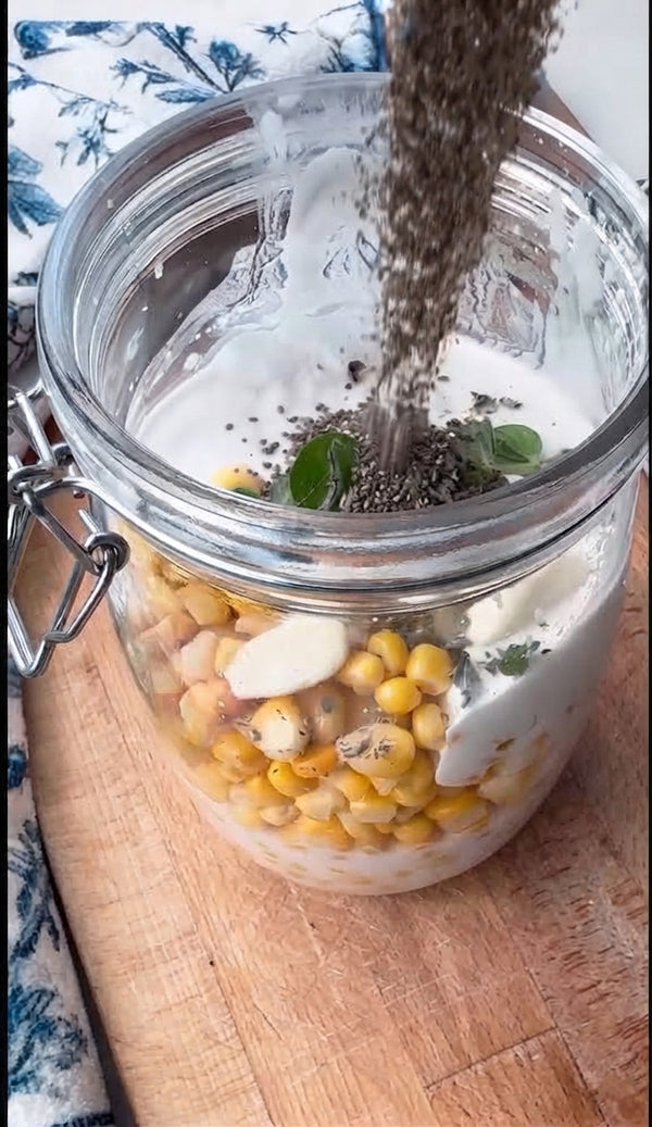 In a blender, combine 1 cup of sweet corn with half of the coconut milk. Blend until smooth and creamy. Reserve the remaining 1 cup of whole corn kernels.