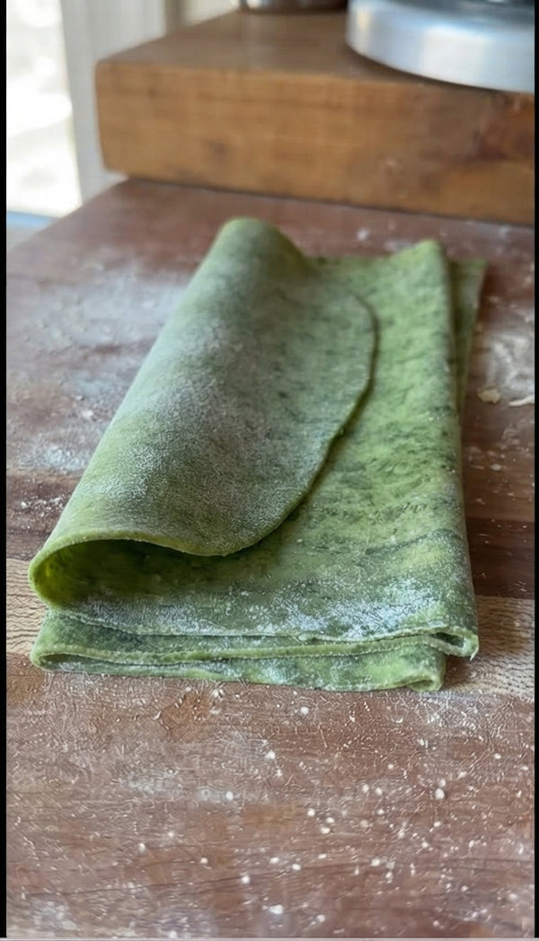 Layer sauce, green pasta sheets, béchamel, mozzarella, and parmesan. Bake at 190°C for 35 minutes until bubbling and golden brown.