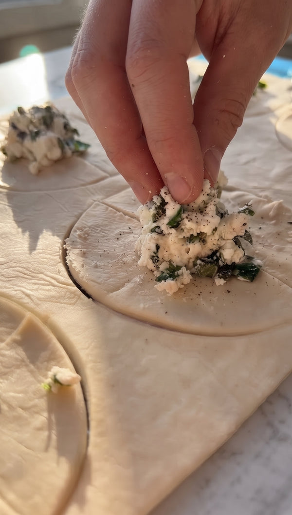 Fold the edges tightly to seal the filling completely into a festive roll, log, or spiral shape.
