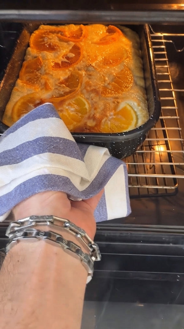 Fold crumbled dry phyllo into wet batter. Pour into a greased baking dish and bake at 180°C (350°F) for 40–45 minutes until golden brown.
