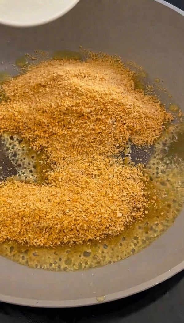 Heat olive oil in a deep pan. Add garlic, harissa, and tomato paste; sauté for 1–2 minutes until fragrant.