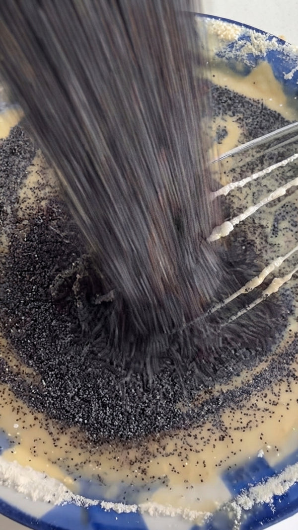 Whisk in ground poppy seeds, flour, baking powder, and salt just until combined.