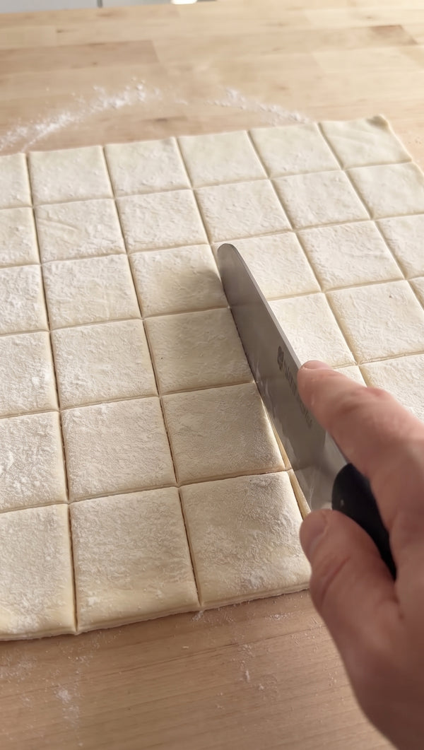 Cut the puff pastry into rectangles slightly larger than the apple arrangements. Place a pastry rectangle over each apple cluster and press the edges down lightly around the apples.