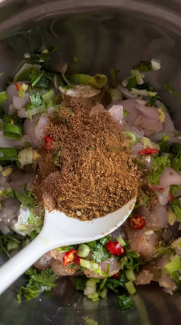Pour in coconut milk, curry powder, fish sauce, and sesame oil (or soy sauce). Stir well to combine and allow the sauce to unify and simmer for 1 minute.
