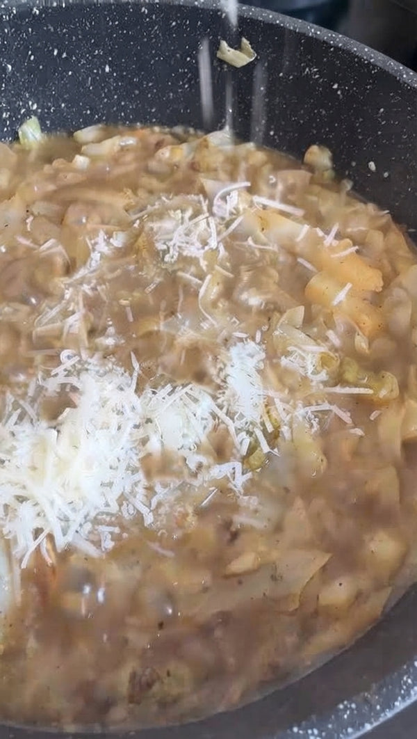 Turn off heat under skillet. Stir in cheese paste immediately, tossing rapidly with cabbage noodles until creamy and glossy.