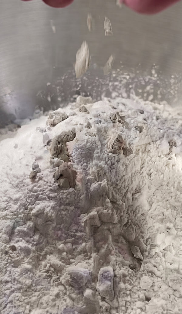 Combine flour, semolina, mashed potato, dry yeast, sugar, and warm water. Knead for 5 minutes, then add salt and 4 tbsp olive oil. Knead until smooth and elastic.