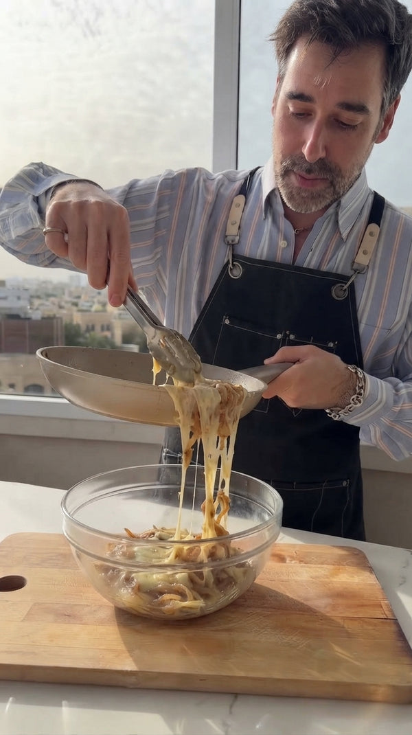 In a large deep skillet, melt butter with olive oil over medium-low heat. Cook sliced onions slowly for 20-25 minutes until deep golden-brown, sweet, and soft.