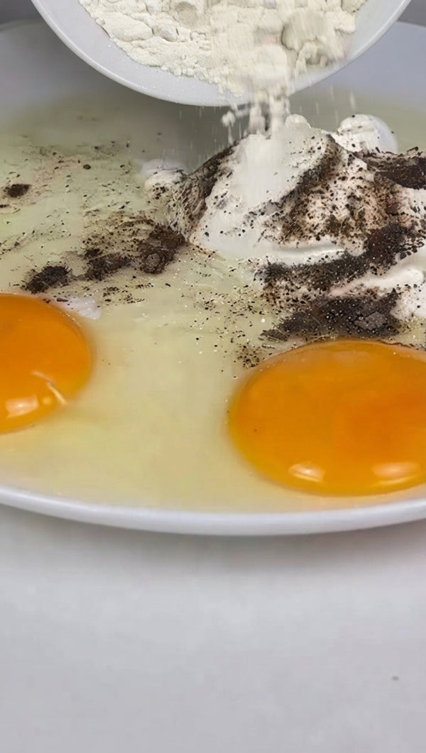 Whisk eggs, sour cream, flour, salt, and pepper into a smooth batter.